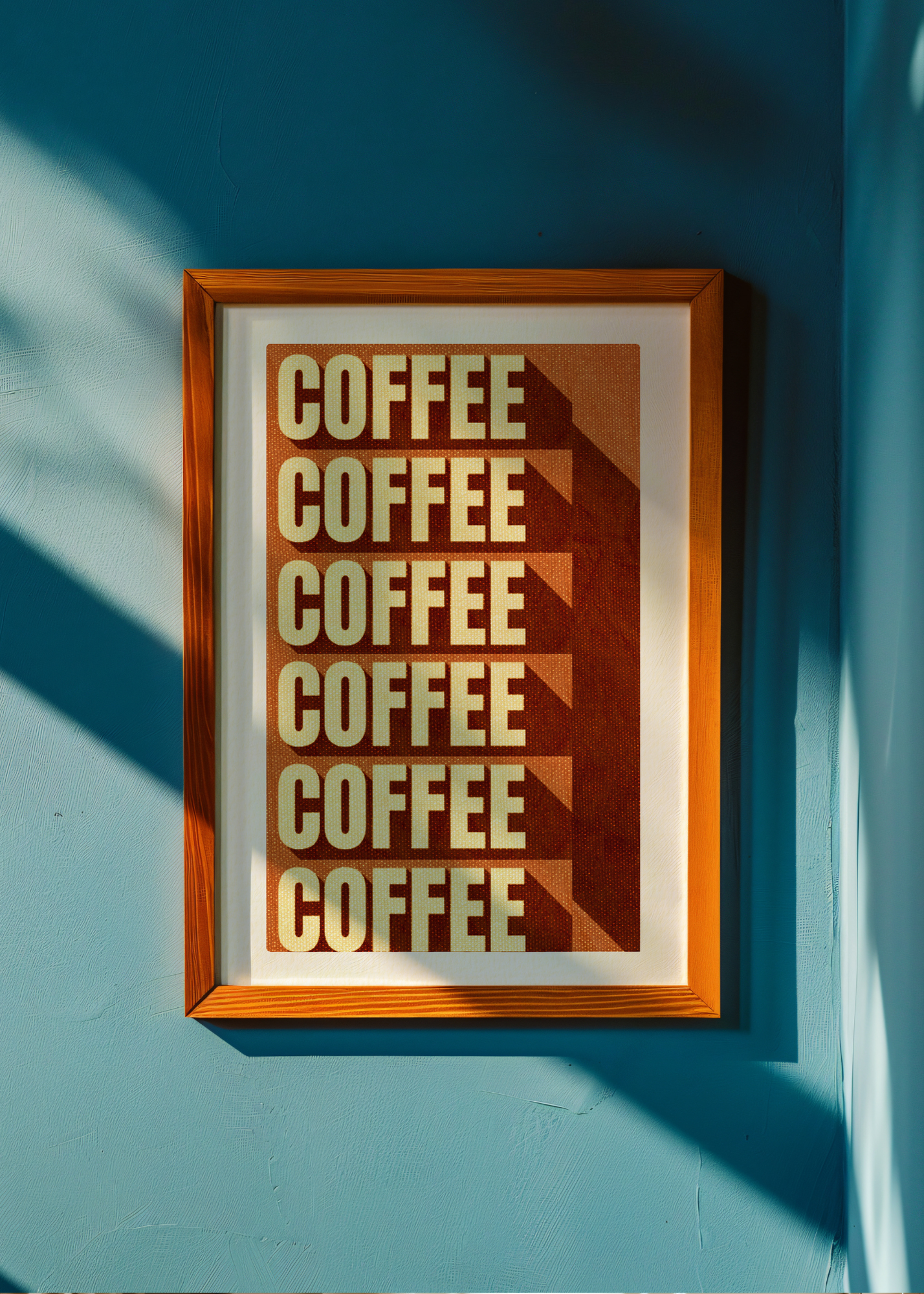 Framed poster with 'COFFEE' text on a blue wall