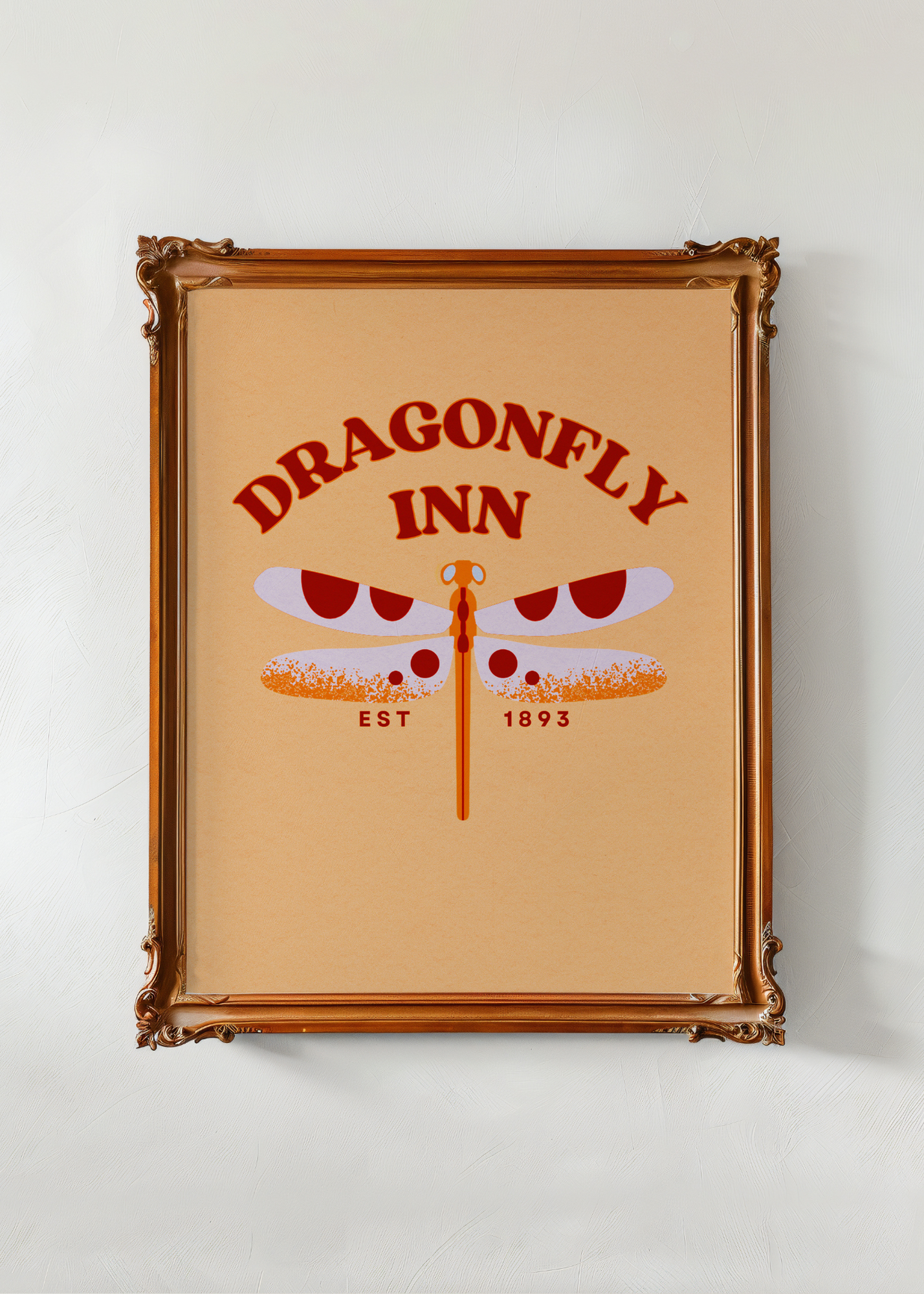 Framed poster of the Dragonfly Inn logo on a beige background