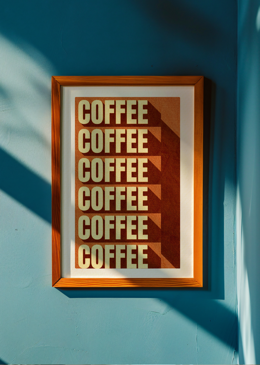 Framed poster with 'COFFEE' text on a blue wall
