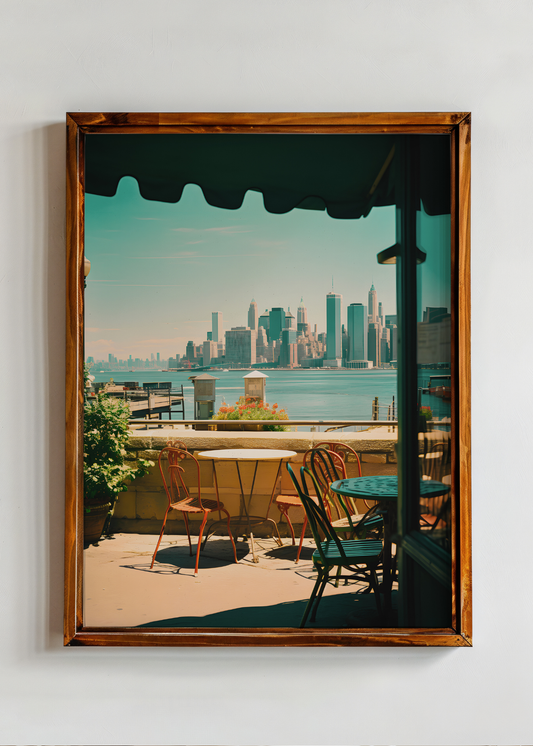 Framed photograph of a city skyline view from an outdoor seating area.