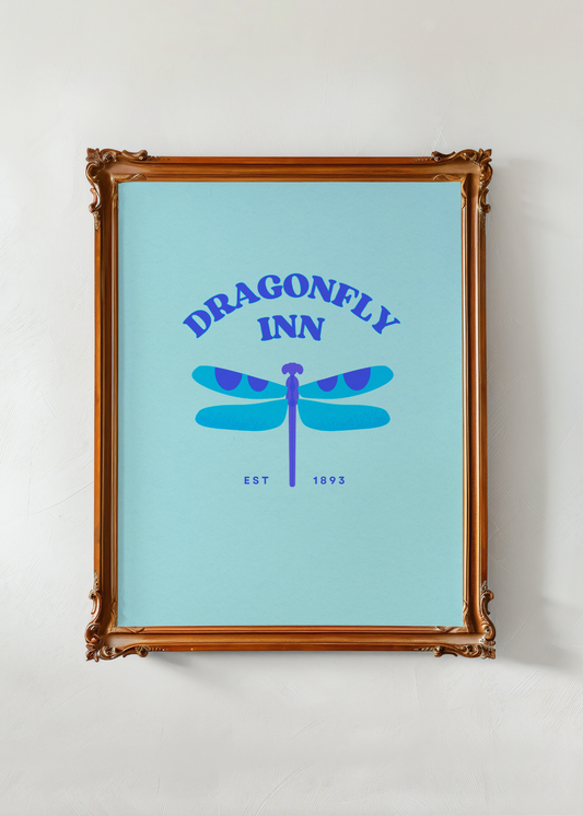 Framed poster with 'Dragonfly Inn' design on a light blue background
