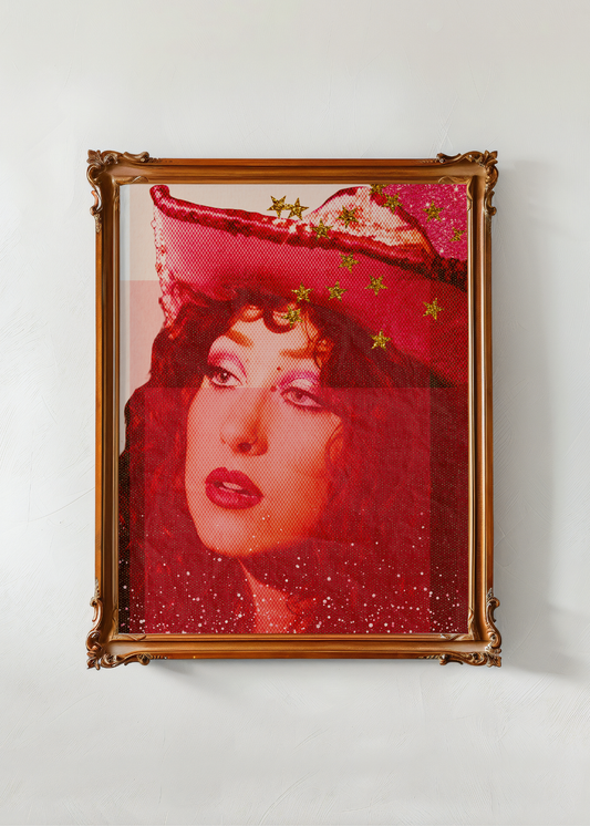 Framed artwork of Chappel Roan wearing a red hat with gold stars on a white wall.