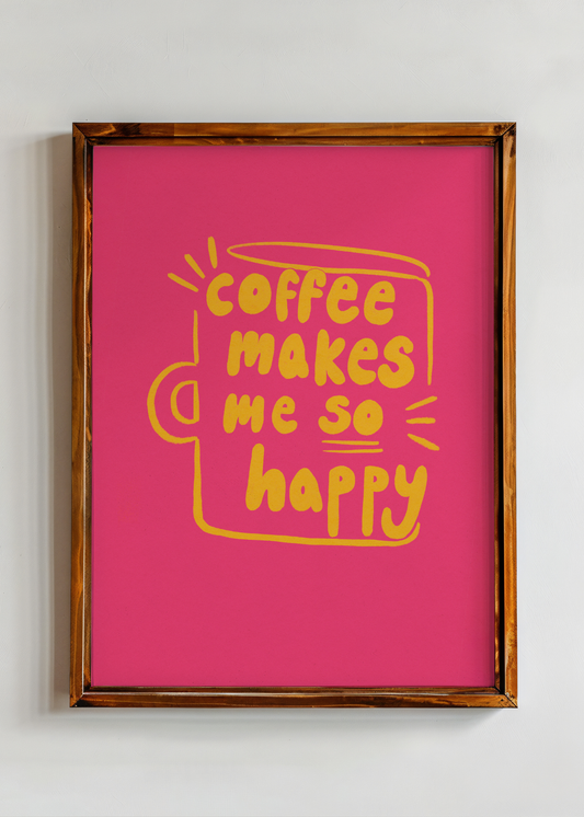 Framed pink poster with yellow text 'Coffee makes me so happy' on a white wall.